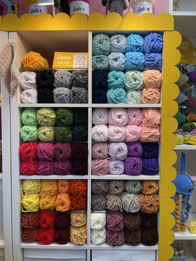 Shelves of YarnArt yarn in every colour