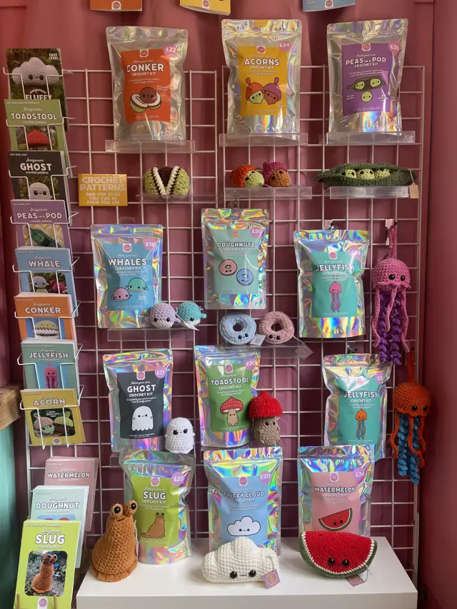 A wall of Cult Crochet kits